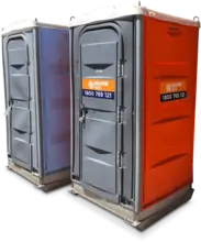 Portable toilet placed at a construction site, providing sanitation and comfort for on-site workers.