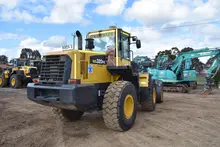 Various rental equipment neatly arranged outdoors, including construction tools and machinery ready for customer use.