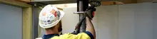 Man installing hydraulic jacking
