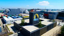 Newly acquired shipping containers lined up in a storage yard, cleaned and prepared for sale or delivery.
